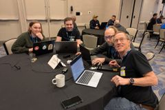 Randy at table doing first-time contributor mentoring.